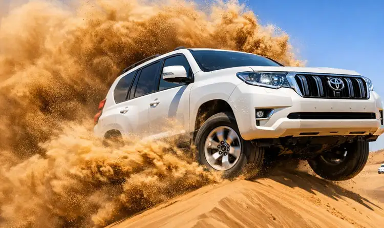 A thrilling 4x4 dune bashing ride across steep golden dunes in the Abu Dhabi desert, with passengers enjoying the adventure.