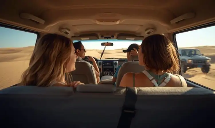 Travelers in a shared 4x4 vehicle for a desert safari in Abu Dhabi, showcasing the different safari experiences available.