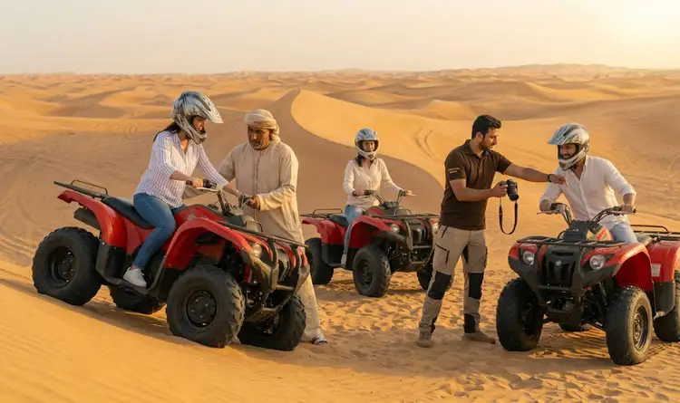 Experienced desert guides assisting tourists on ATVs and offering photography help during a safe session of quad biking Abu Dhabi for beginners.